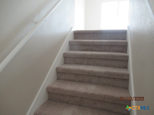 195 Azure Cove Kyle, TX 78640 - Photo 15 of 36 a view of staircase with white walls