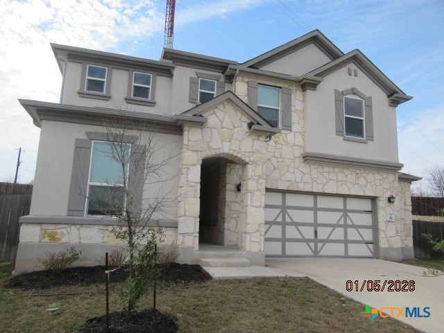 195 Azure Cove Kyle, TX 78640 - Photo 2 of 36 a front view of a house with a yard