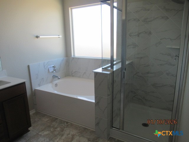 195 Azure Cove Kyle, TX 78640 - Photo 24 of 36 a bathroom with a bathtub and shower