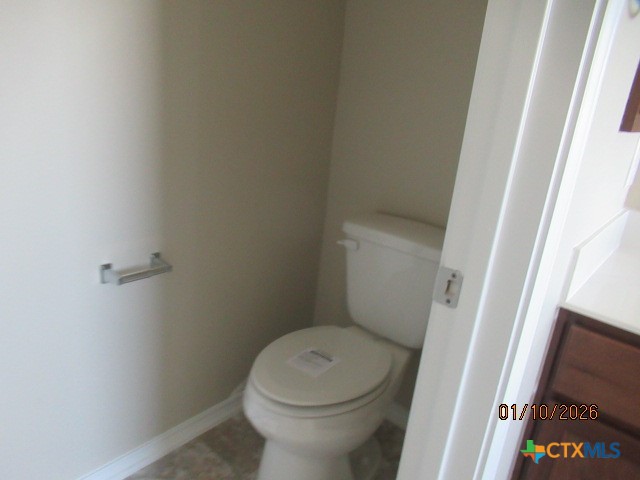195 Azure Cove Kyle, TX 78640 - Photo 25 of 36 a white toilet sitting next to a sink