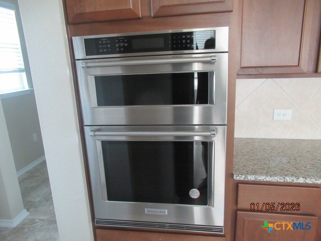 195 Azure Cove Kyle, TX 78640 - Photo 26 of 36 a stove top oven sitting inside of a kitchen
