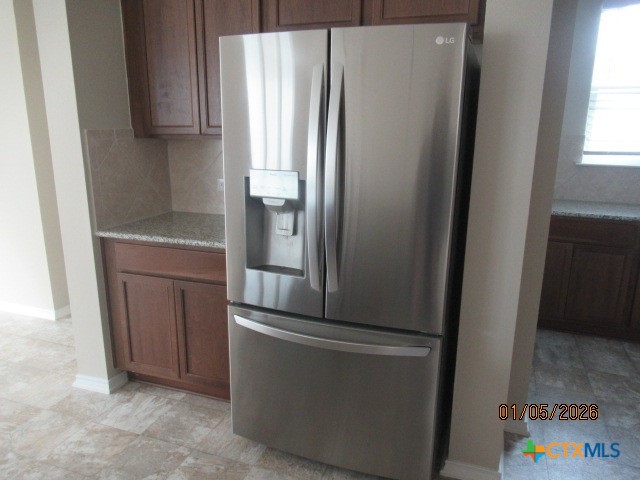 195 Azure Cove Kyle, TX 78640 - Photo 27 of 36 a kitchen with metallic refrigerator freezer and a dishwasher
