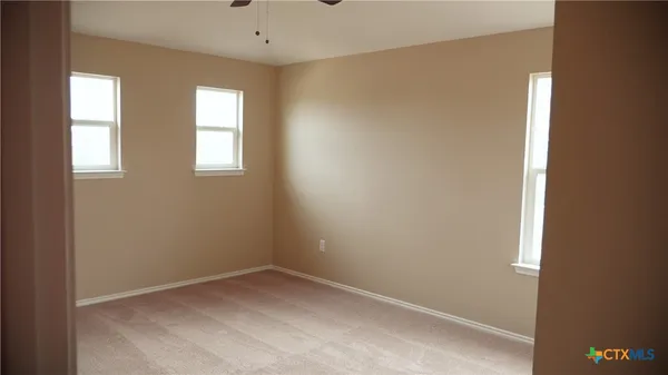 a view of staircase with white walls