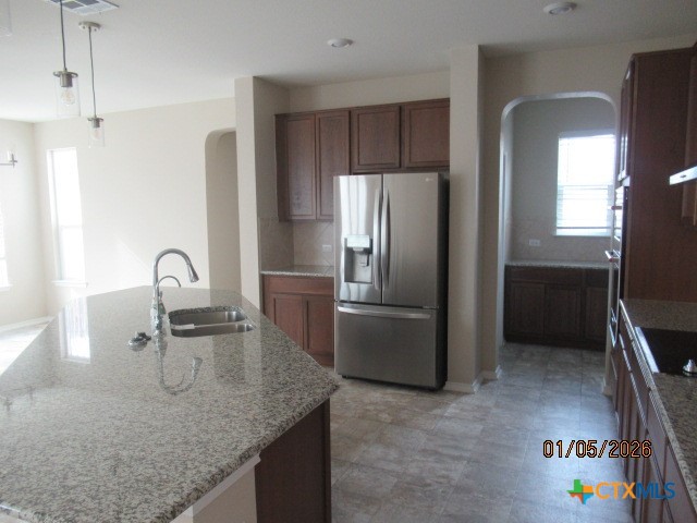 195 Azure Cove Kyle, TX 78640 - Photo 8 of 36 a kitchen with granite countertop a refrigerator and a sink