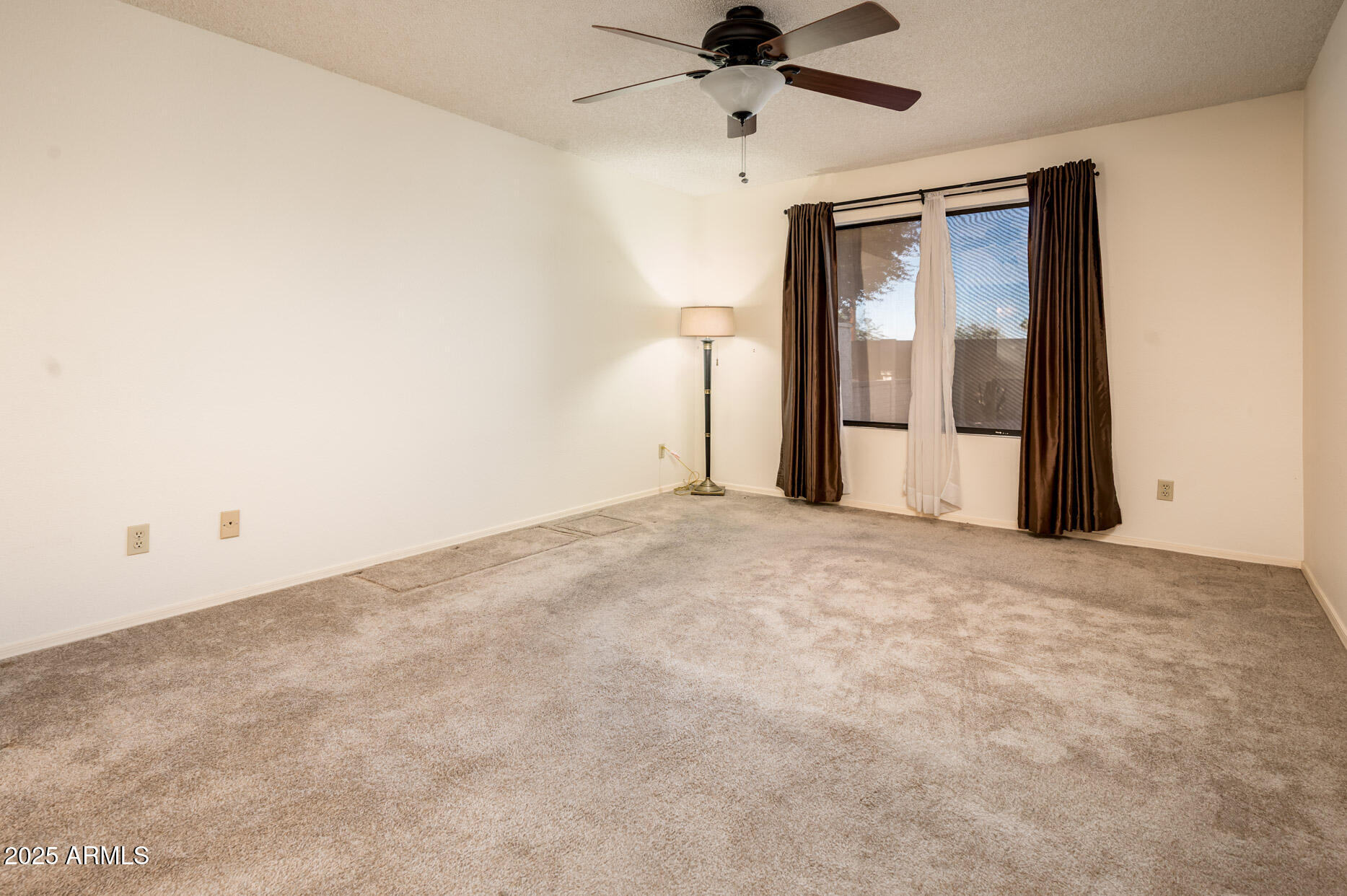 538 South 76th Place Mesa, AZ 85208 - Photo 13 of 50 a view of a big room with wooden floor and windows in a bedroom