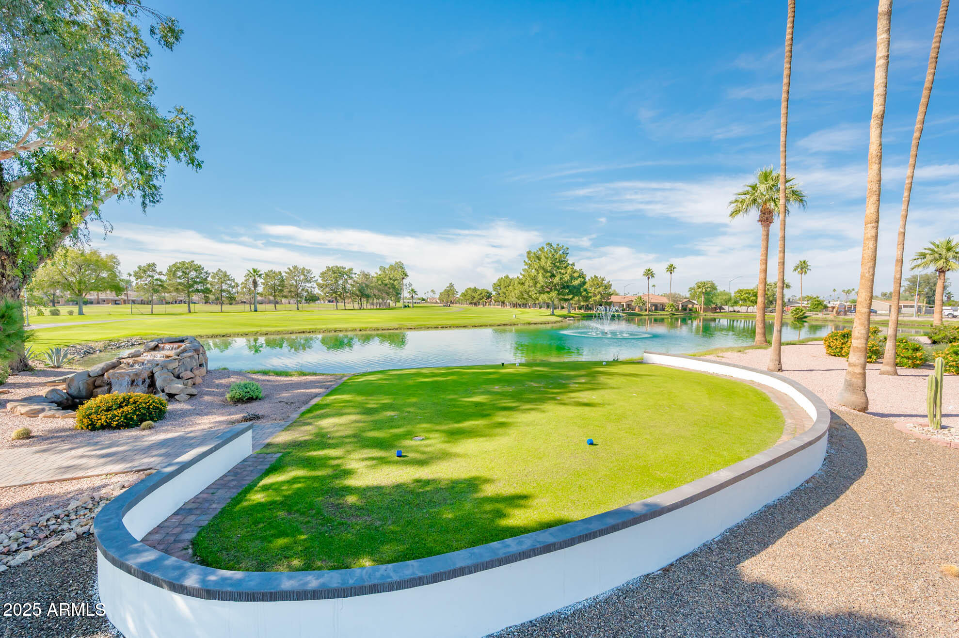 538 South 76th Place Mesa, AZ 85208 - Photo 30 of 50 a view of a swimming pool with a lawn chairs