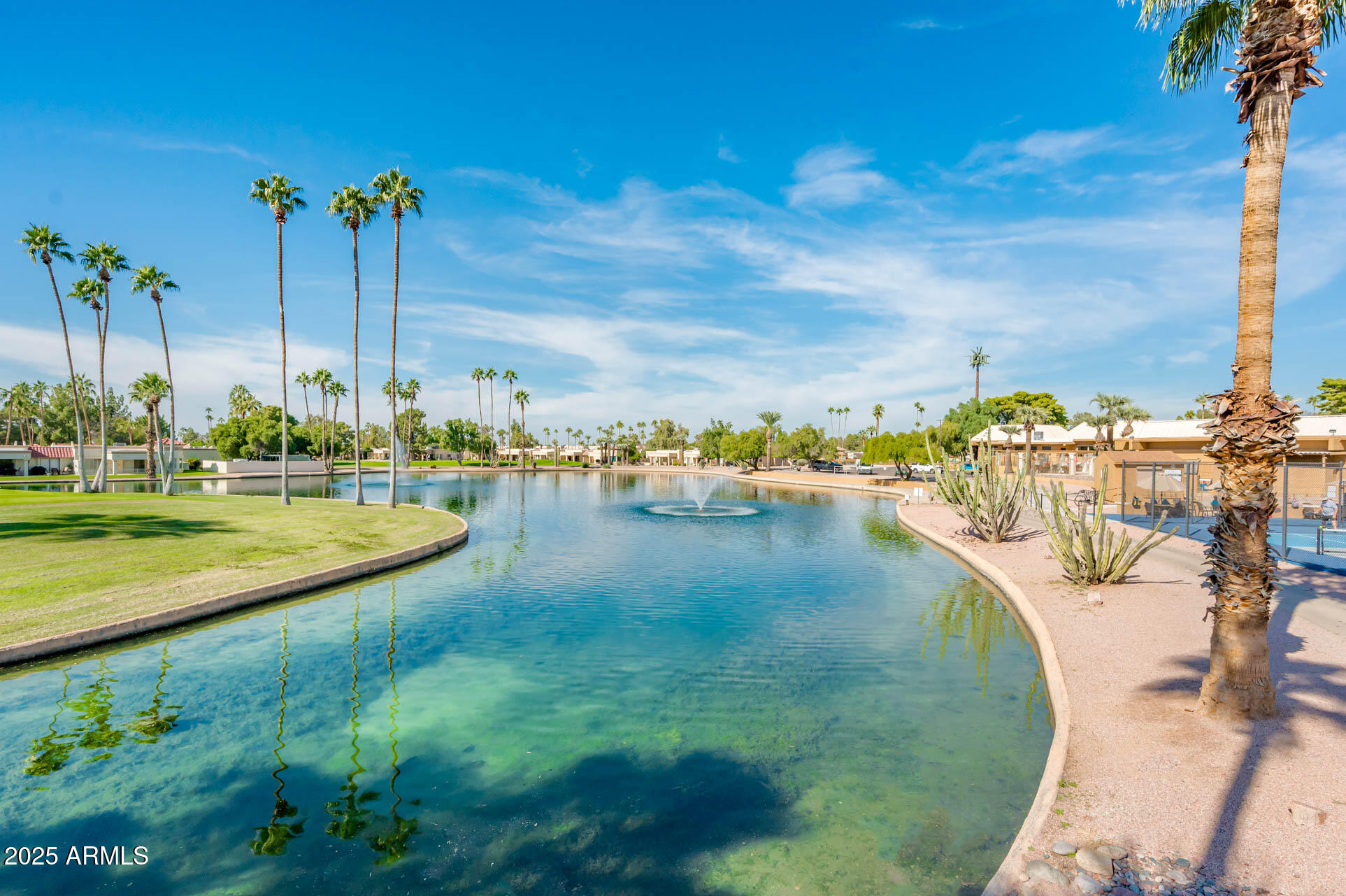 538 South 76th Place Mesa, AZ 85208 - Photo 37 of 50 a view of a swimming pool with a yard and lake view