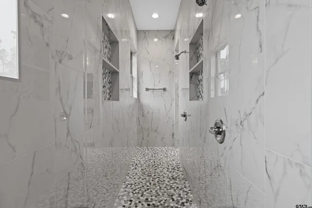 a bathroom with a granite countertop toilet a sink and a mirror