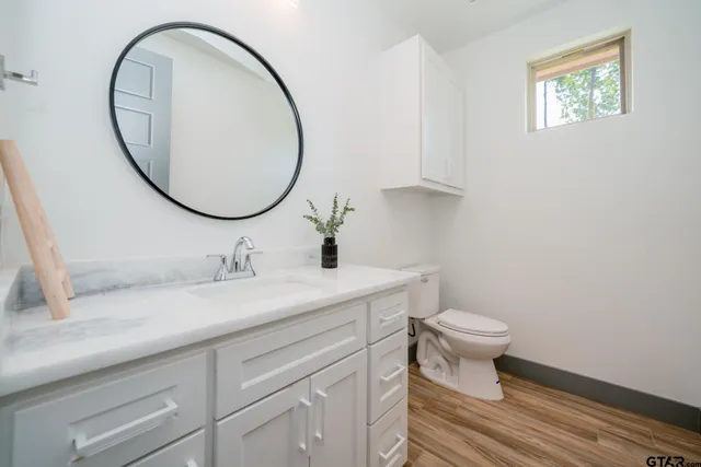 a view of a porch with a table and chairs