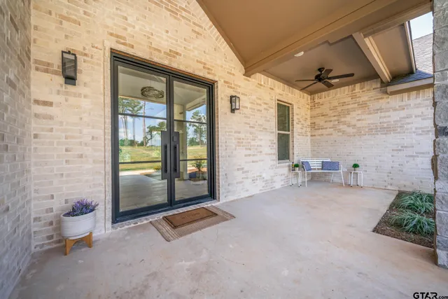 a view of open kitchen with furniture and a fireplace