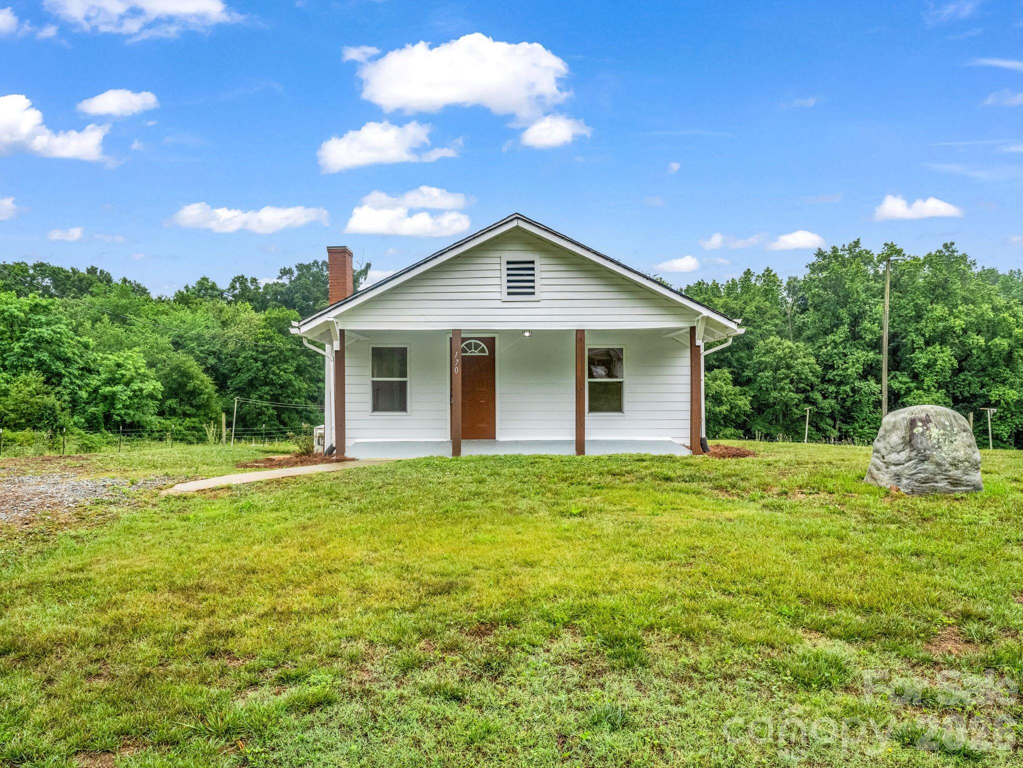 170 Dobbins Road Ellenboro, NC 28040 - Photo 4 of 32 a house view with a garden space