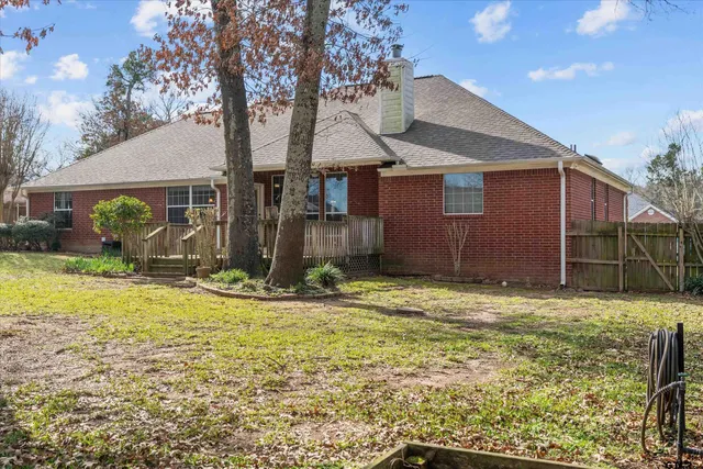 a house view with a backyard space