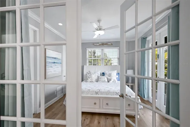 a kitchen with stainless steel appliances a stove and a wooden floor