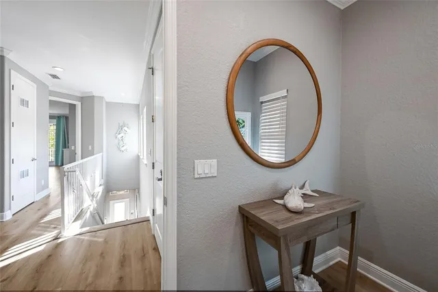 a bathroom with a sink vanity tub and a mirror