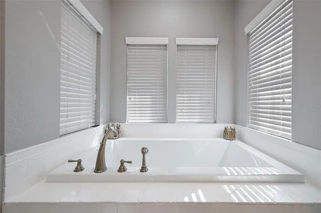 a living room with furniture a table and wooden floor
