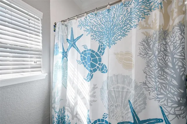 a view of a backyard with couches table and chairs