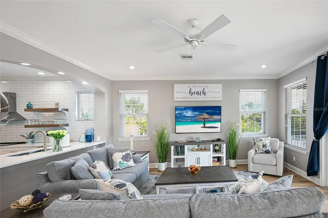 a living room with fireplace furniture and a flat screen tv