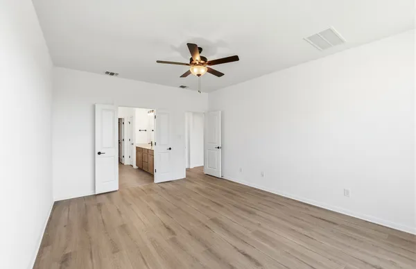 a view of an entryway with wooden floor and door