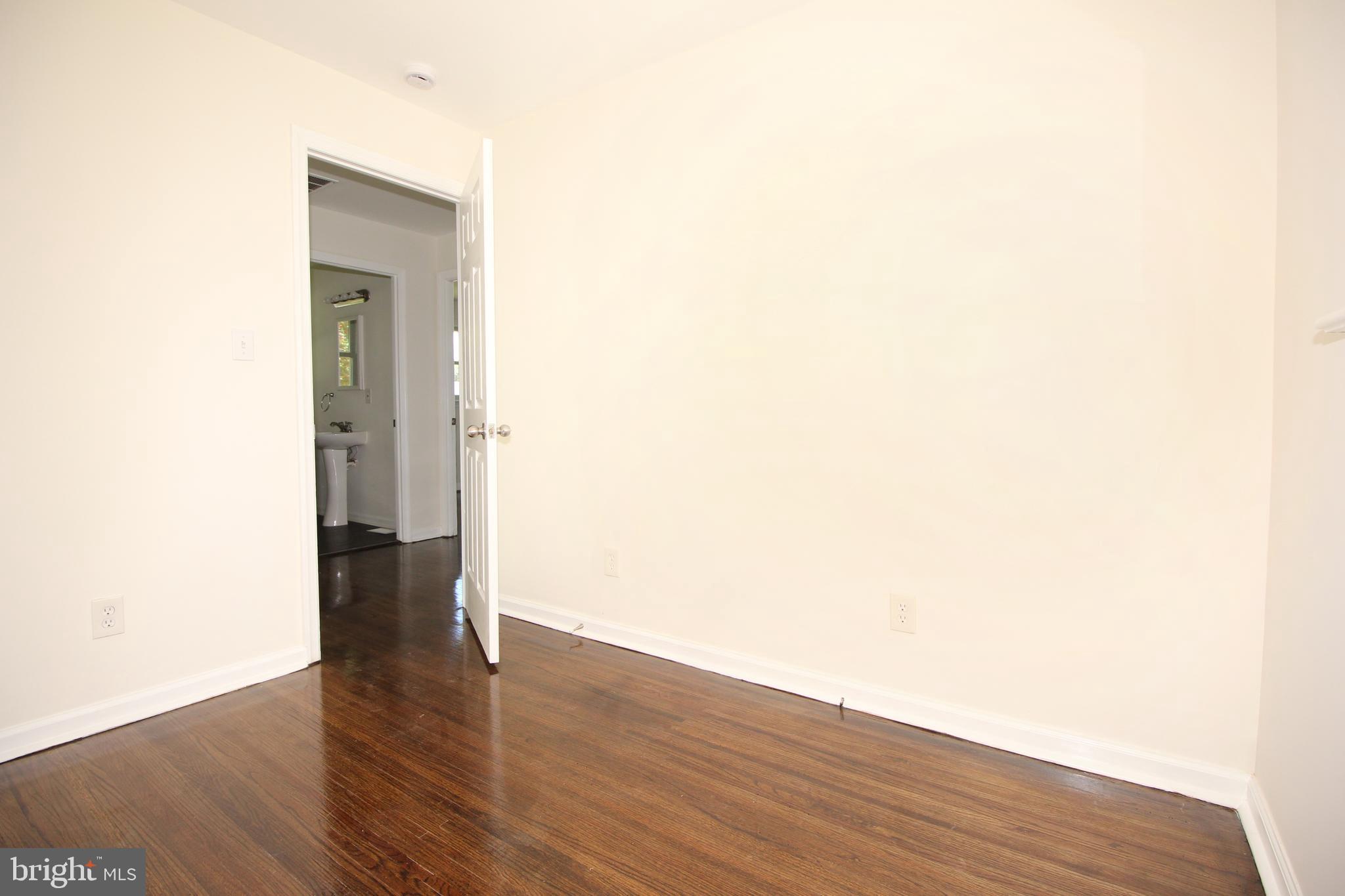 12 Estate Road Lumberton, NJ 08048 - Photo 12 of 30 a view of a hallway with wooden floor