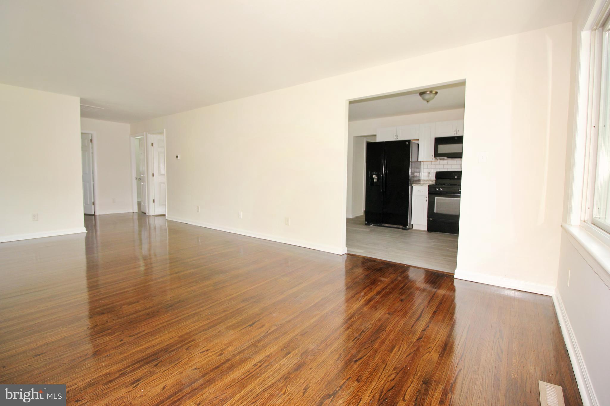 12 Estate Road Lumberton, NJ 08048 - Photo 9 of 30 an empty room with wooden floor and entrance