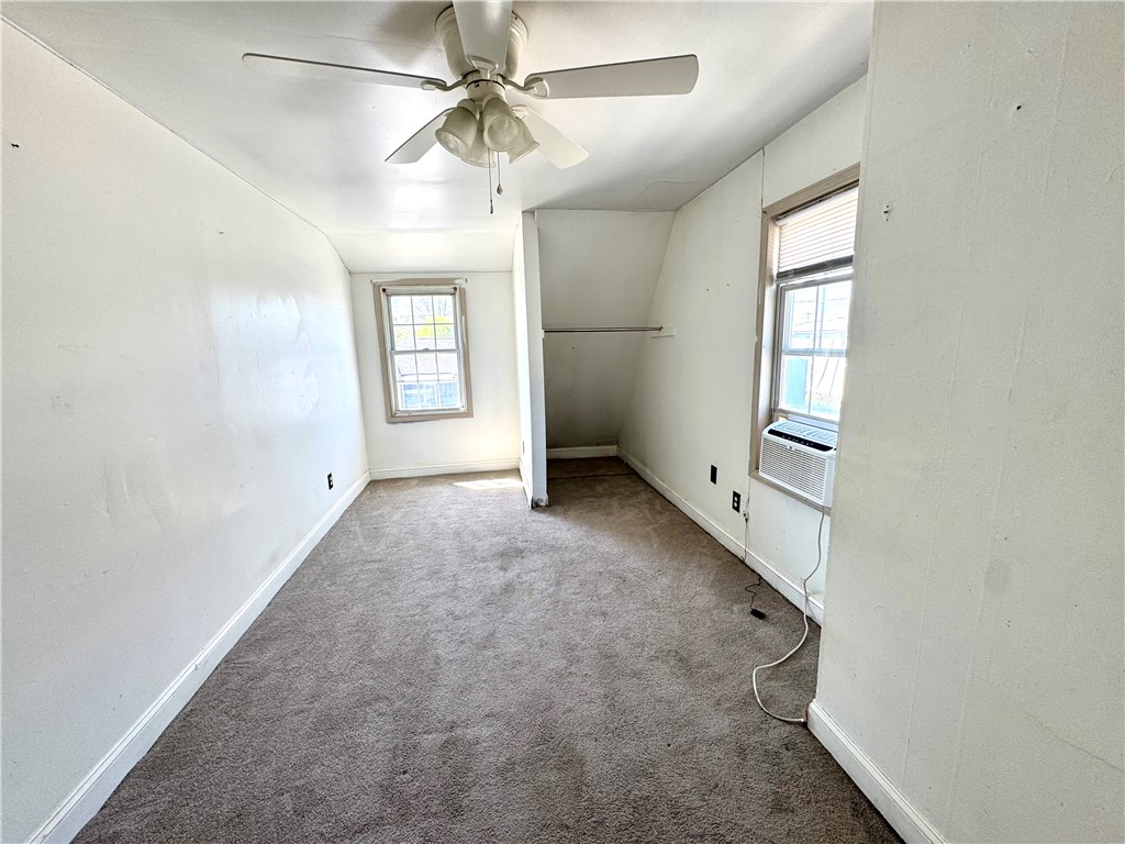 348 Fairview Avenue Hamilton, OH 45015 - Photo 6 of 9 This spacious bedroom offers ample natural light and comfortable carpeting throughout.