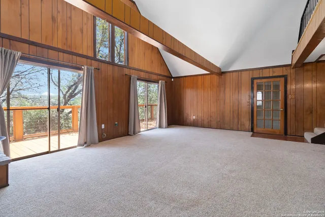 a view of an empty room with a fireplace