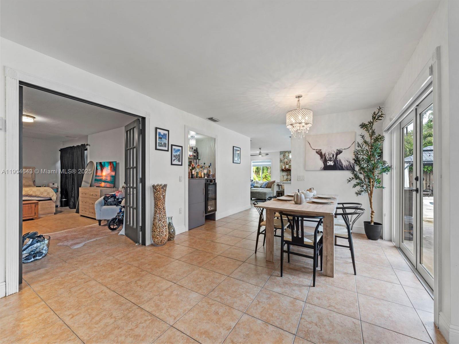 12825 Southwest 107th Terrace Miami, FL 33186 - Photo 11 of 43 a view of a dining room with furniture and a livingroom