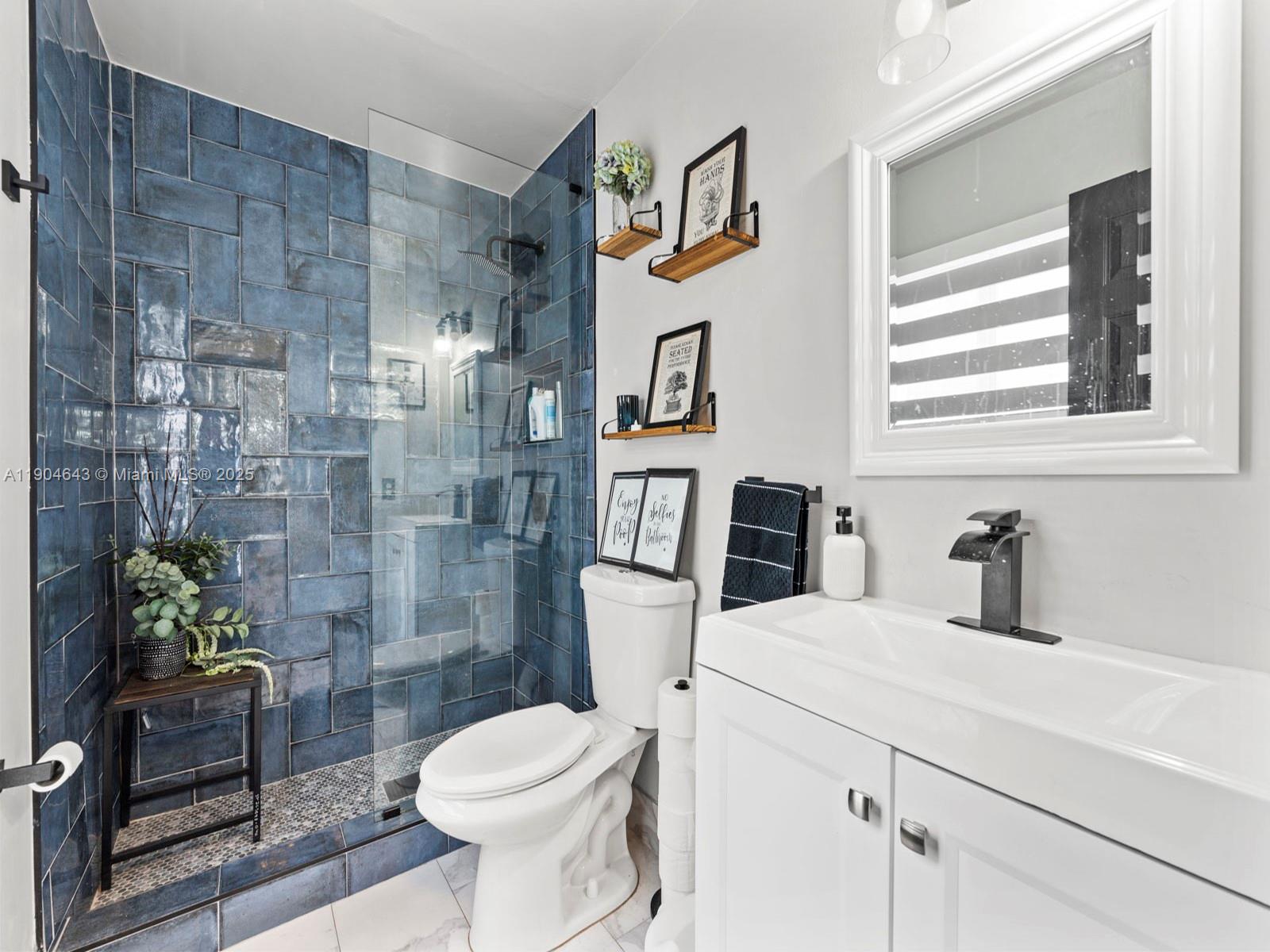 12825 Southwest 107th Terrace Miami, FL 33186 - Photo 24 of 43 a bathroom with a toilet sink and shower