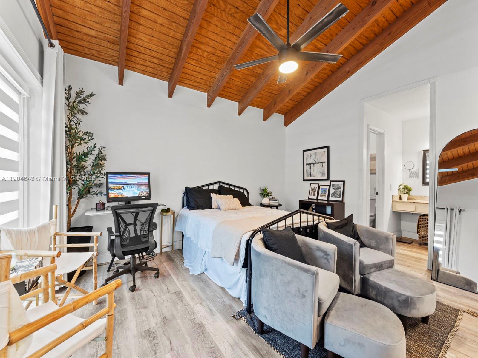 12825 Southwest 107th Terrace Miami, FL 33186 - Photo 25 of 43 a living room with furniture a fireplace and a table