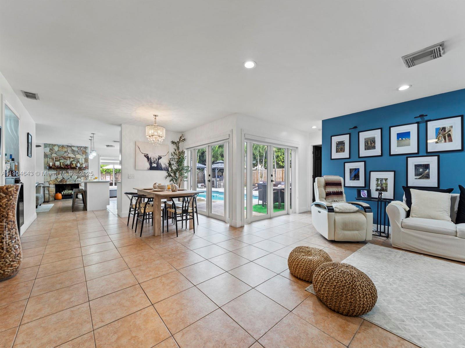 12825 Southwest 107th Terrace Miami, FL 33186 - Photo 7 of 43 a living room with furniture and a table