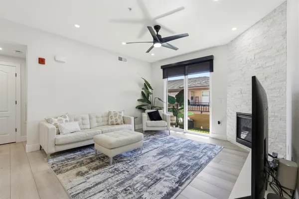 a kitchen with stainless steel appliances a stove sink microwave and cabinets