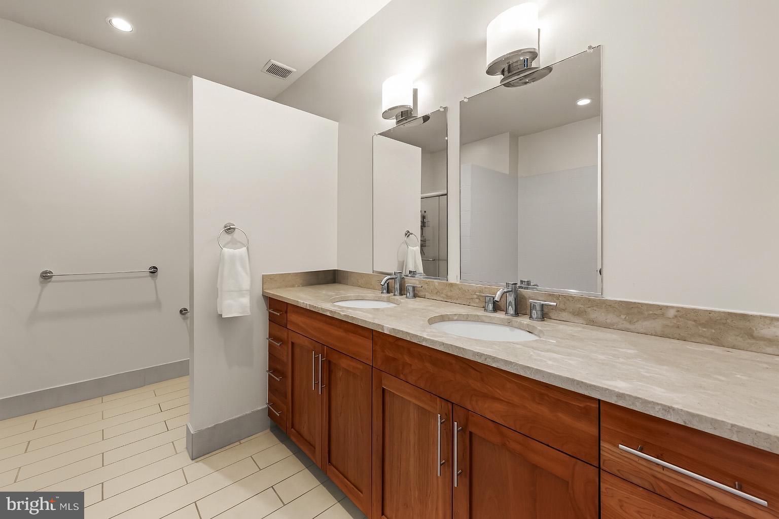 1200 Steuart Street, Unit 912 Baltimore, MD 21230 - Photo 14 of 45 Ensuite w/ double vanity