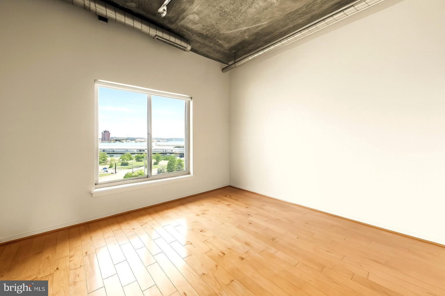 1200 Steuart Street, Unit 912 Baltimore, MD 21230 - Photo 16 of 45 Extra-large window fills second bedroom with light