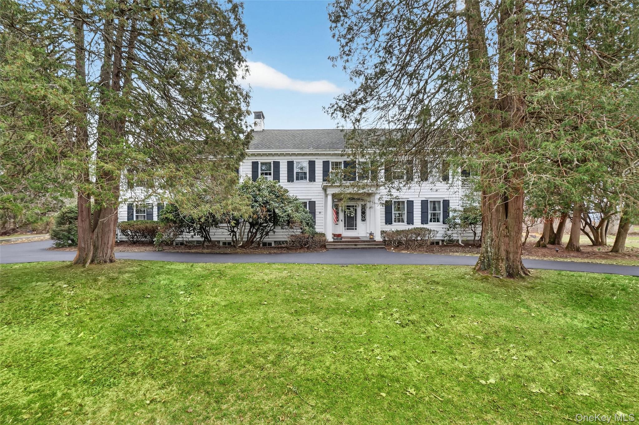 front view of a house with a garden
