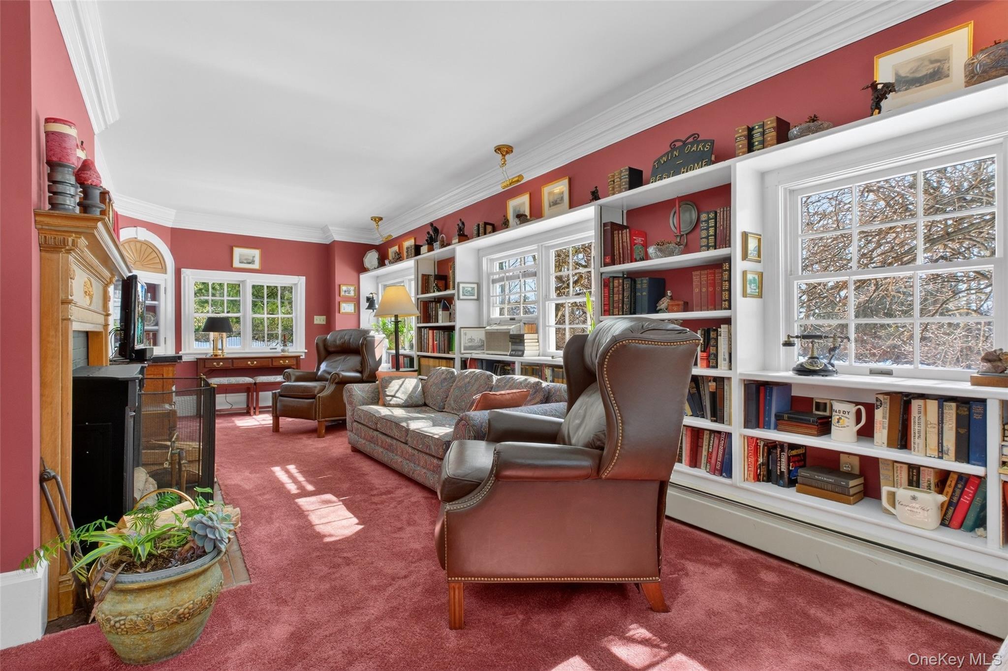 79 Old Balmville Road Newburgh, NY 12550 - Photo 11 of 45 a living room with furniture lamp and book shelf