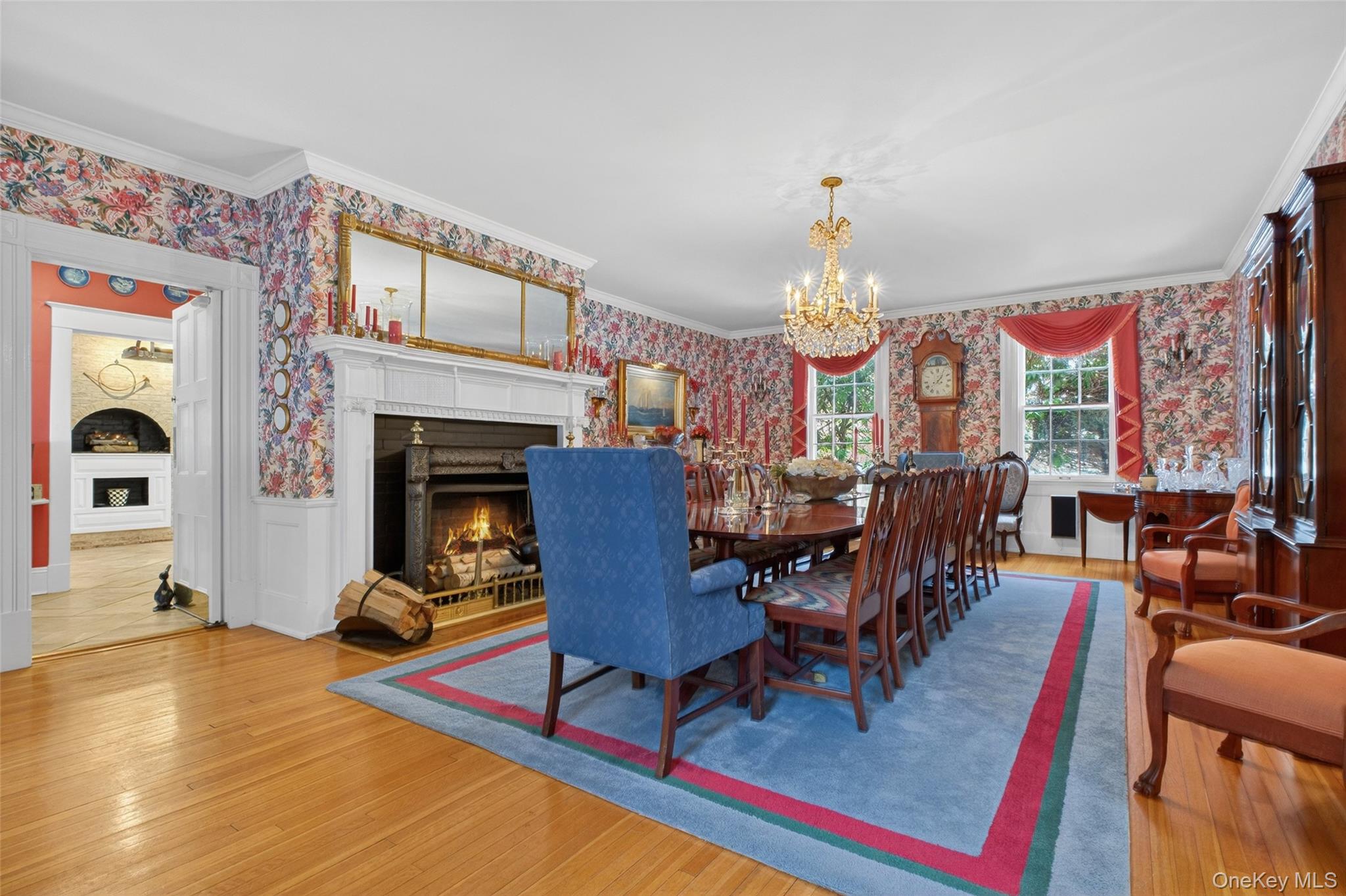 79 Old Balmville Road Newburgh, NY 12550 - Photo 13 of 45 a view of a dining room with furniture a chandelier and wooden floor