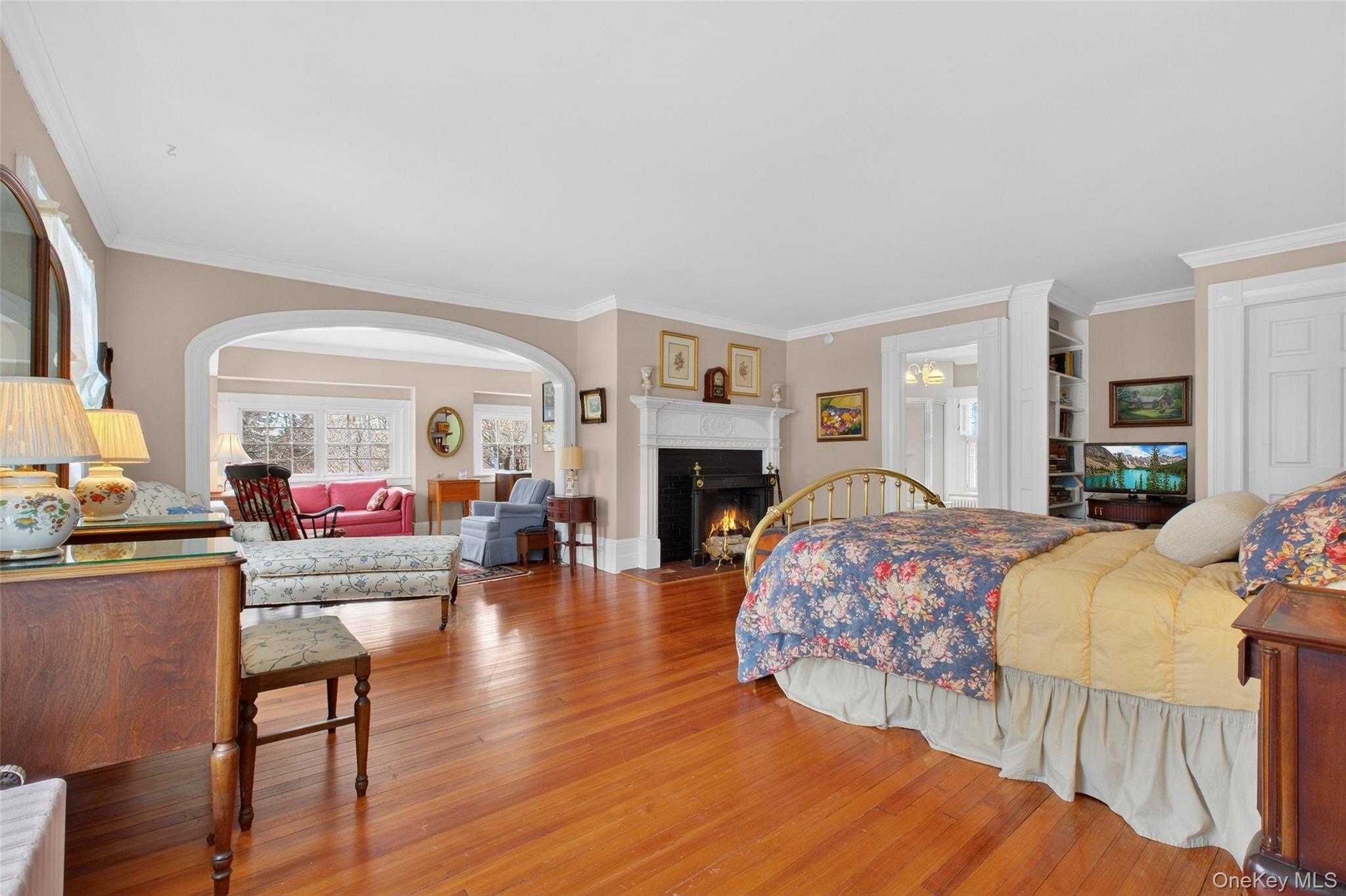 79 Old Balmville Road Newburgh, NY 12550 - Photo 24 of 45 a bedroom with furniture and a fireplace