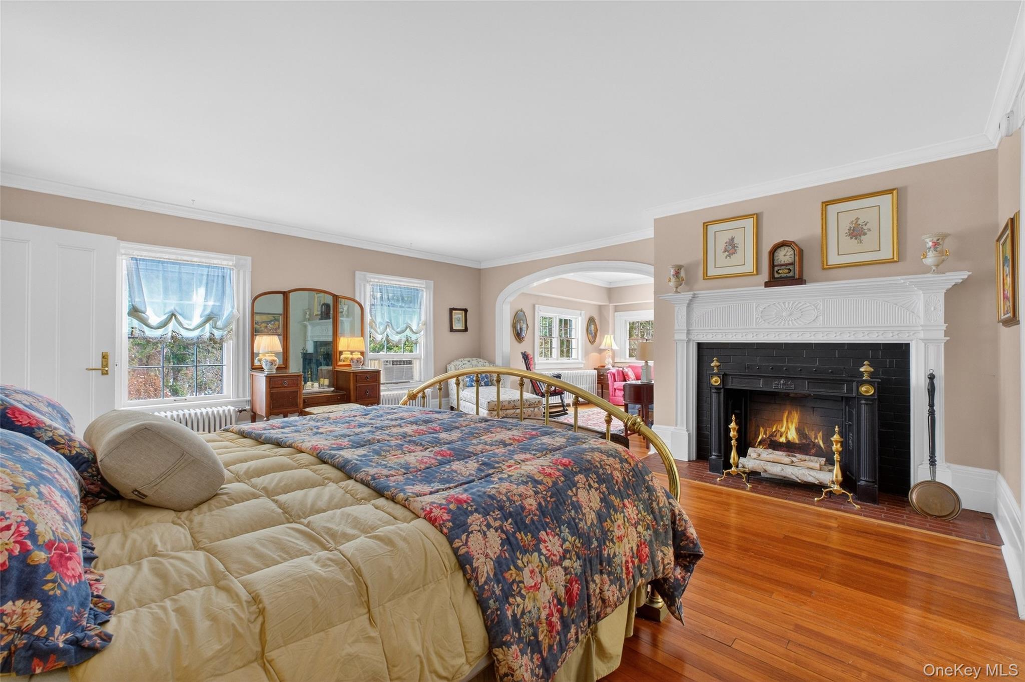 79 Old Balmville Road Newburgh, NY 12550 - Photo 25 of 45 a bedroom with a bed and a fireplace