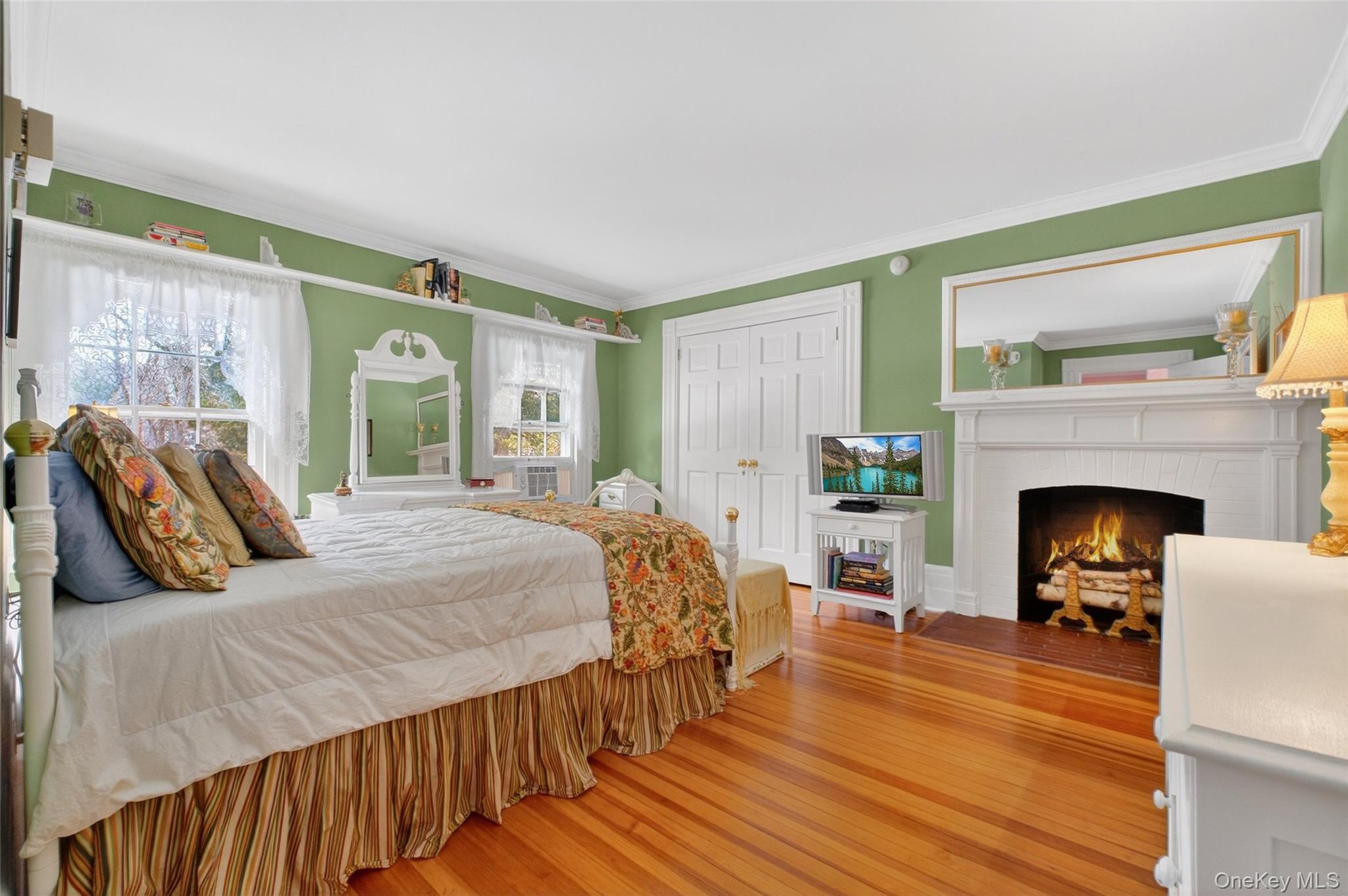 79 Old Balmville Road Newburgh, NY 12550 - Photo 29 of 45 a bedroom with a bed and a fireplace