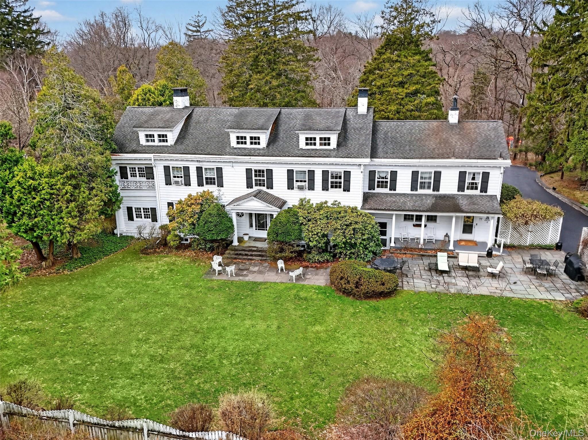 79 Old Balmville Road Newburgh, NY 12550 - Photo 38 of 44 a front view of a house with garden and trees