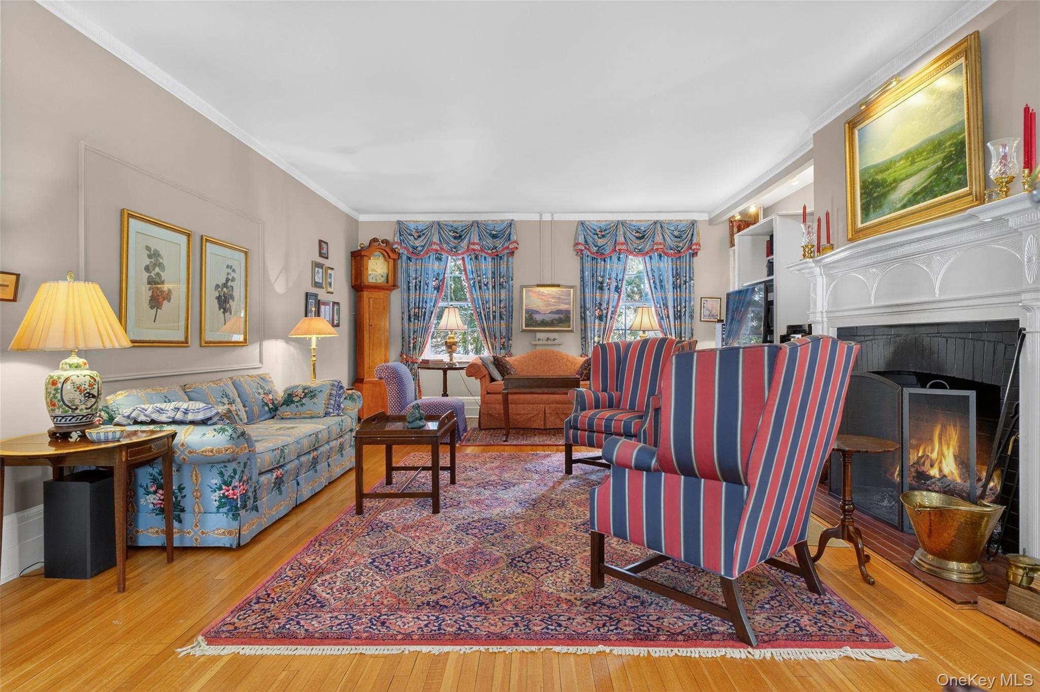 79 Old Balmville Road Newburgh, NY 12550 - Photo 8 of 45 a living room with furniture a rug and a fireplace