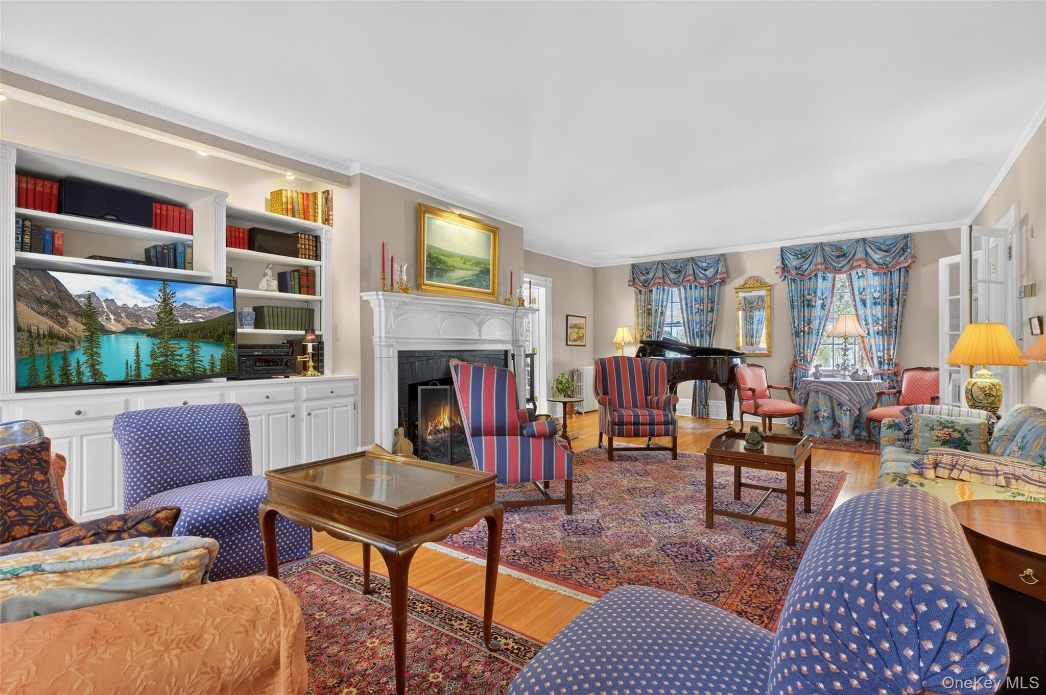 79 Old Balmville Road Newburgh, NY 12550 - Photo 9 of 45 a living room with furniture fireplace and a large window
