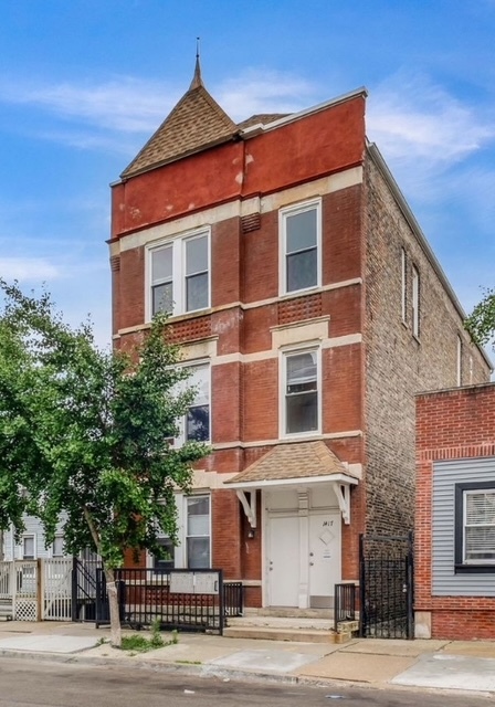 1417 West Cullerton Street, Unit 3 Chicago, IL 60608 - Photo 1 of 6 a front view of a building