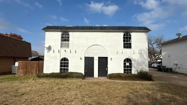 a front view of a house with a garage