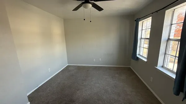 an empty room with windows