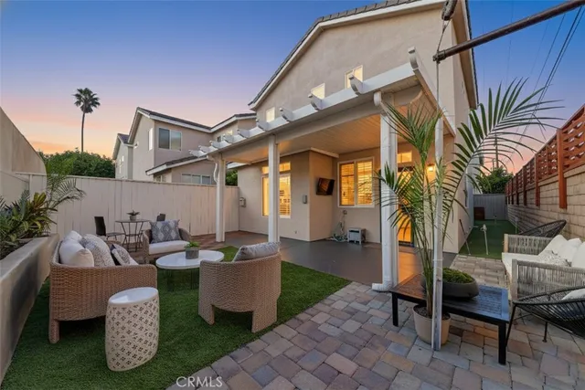 a living room with fireplace furniture and a wooden floor