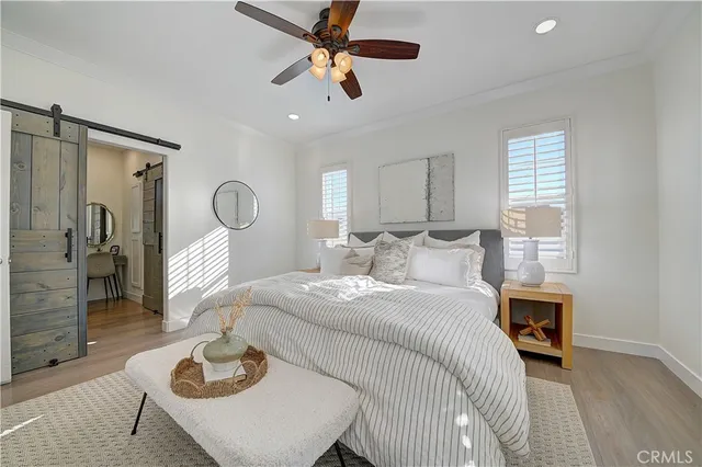 a spacious bathroom with a granite countertop sink mirror and bathtub