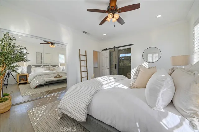 a bathroom with a granite countertop sink a mirror and a shower