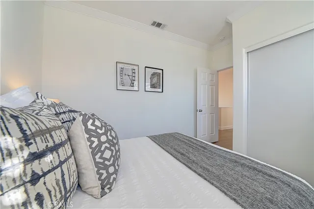 a view of a patio with table and chairs potted plants and a palm tree
