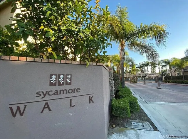 a view of a swimming pool with a table and chairs